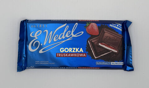 Blue E.Wedel dark chocolate bar with strawberry filling, showing chocolate squares and a fresh strawberry on the wrapper.