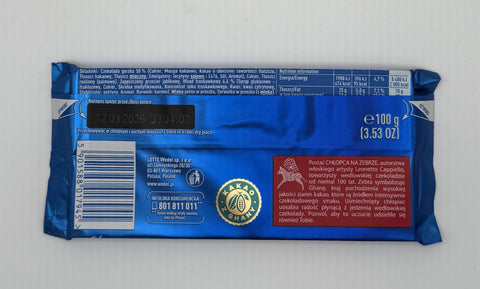 Blue E.Wedel dark chocolate bar with strawberry filling, showing chocolate squares and a fresh strawberry on the wrapper.